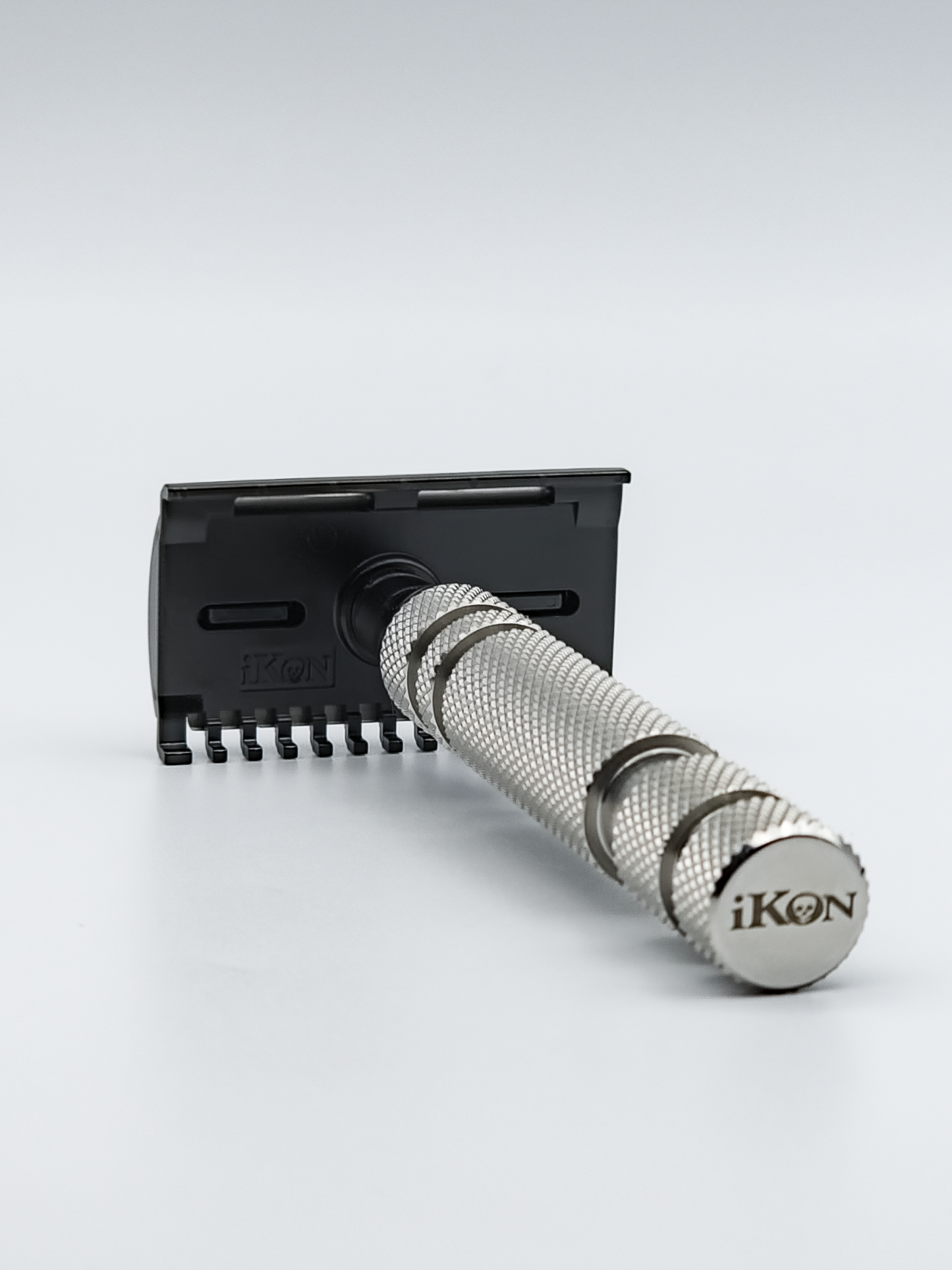 iKon B1 OSS Razor with an iKon OSS Handle, Sideways showing iKon Logo