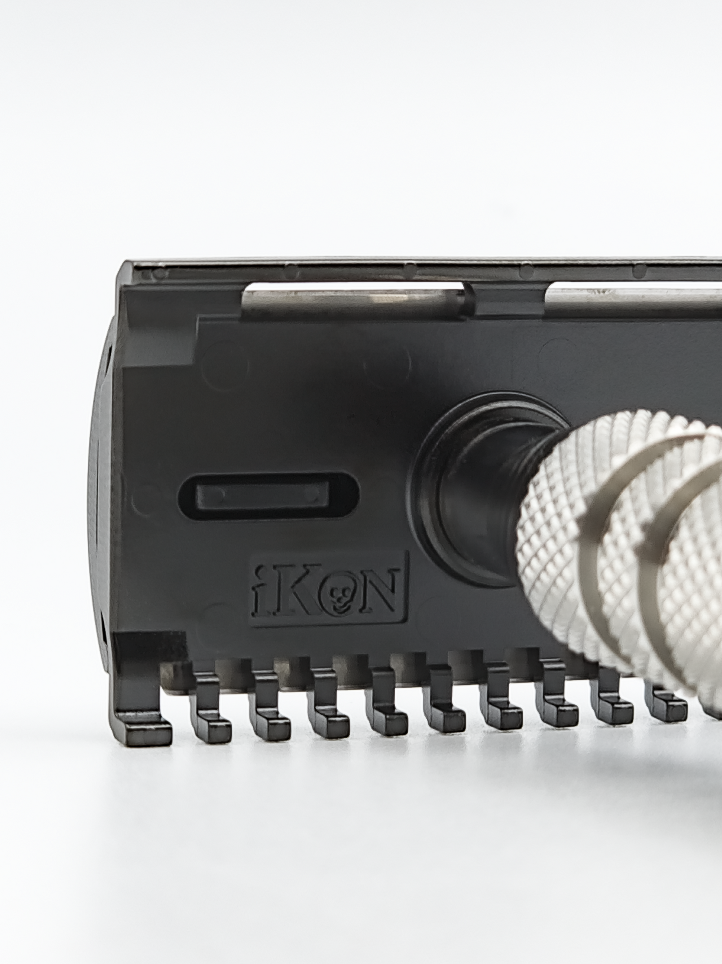 iKon B1 OSS Razor with an iKon OSS Handle, Sideways showing iKon Logo Zoomed In